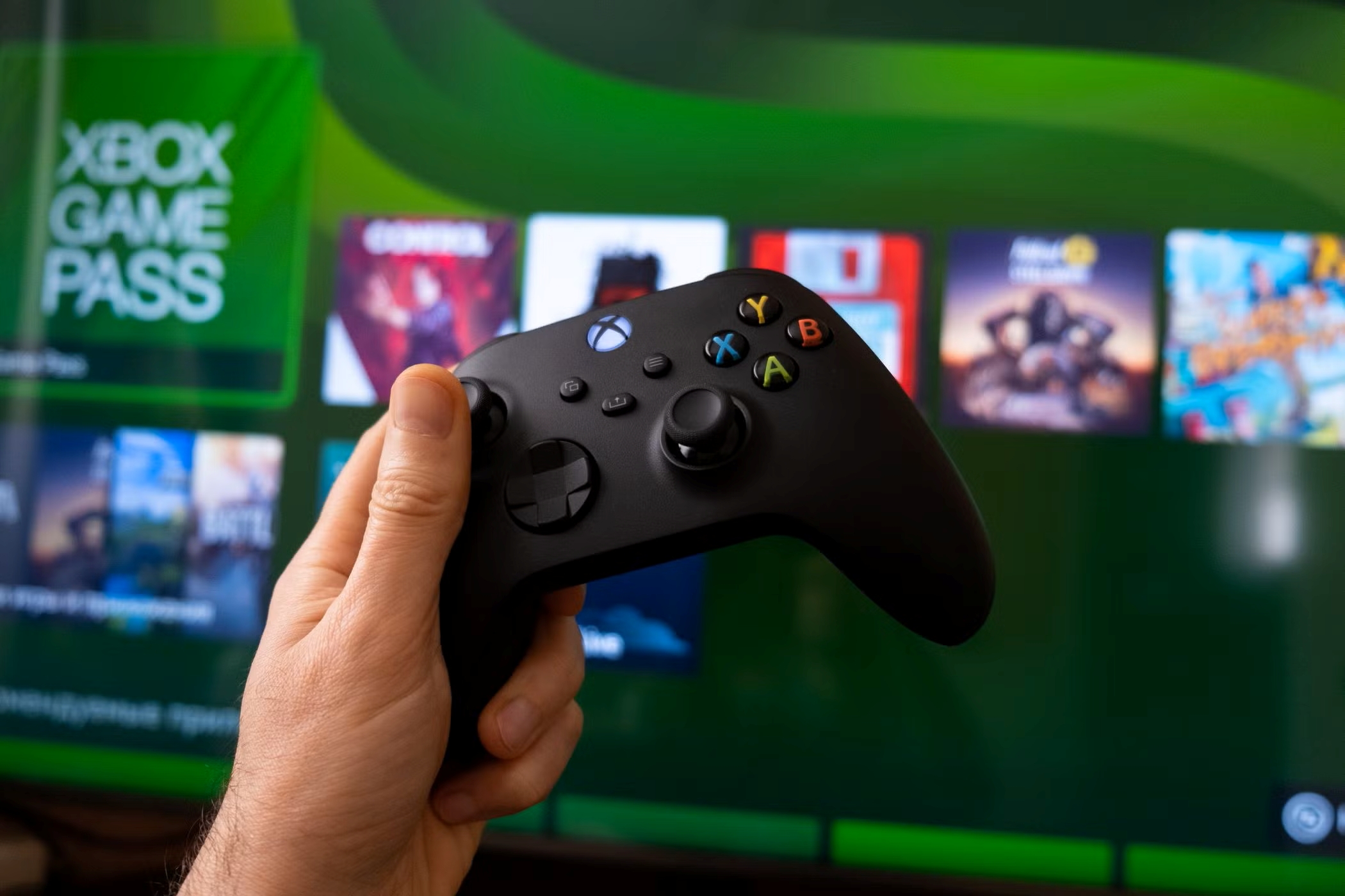 Xbox Game Pass Core subscription redemption screen next to an Xbox controller.