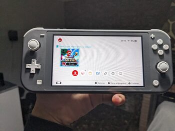Nintendo Switch Lite + Cargador Generico ( Perfecta )