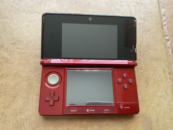 Nintendo 3DS roja con juegos