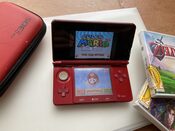 Nintendo 3DS roja con juegos