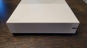 Xbox One S with a controller and video games