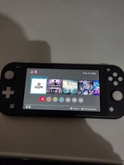 Nintendo switch lite + pack de 4 juegos  for sale