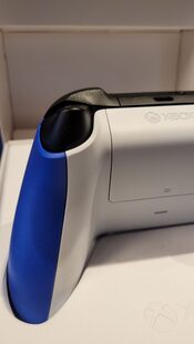 Xbox One S with a controller and video games