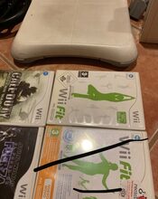 pack WII blanca y otra negra con accesorios y wii balance board  for sale