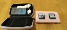 Redeem Nintendo DS Lite rosa + funda y 2 juegos