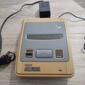 Super Nintendo original con adaptador de corriente 