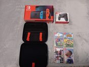 Nintendo Switch + Mando Pro + 4 Juegos + Accesorios.